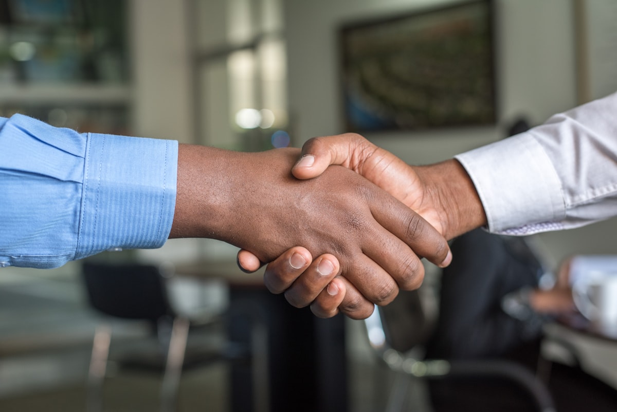 Business partners shaking hands after a successful engagement