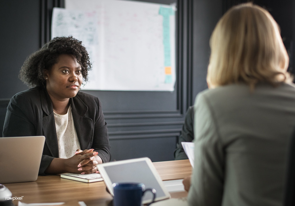 Business consultant leading a strategic discussion in a boardroom meeting